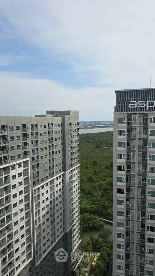 Stunning high-rise buildings with lush greenery and water view
