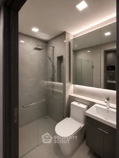 Modern bathroom with sleek design, glass shower, and elegant fixtures.