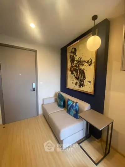 Modern living room with stylish sofa and jazz-themed artwork