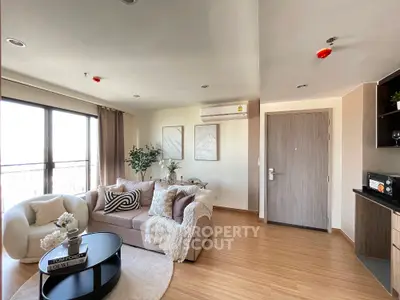 Modern living room with cozy seating and stylish decor in a bright apartment