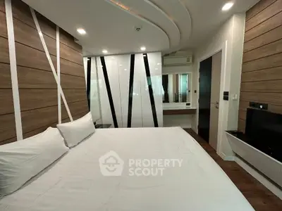 Modern bedroom with stylish wood paneling and sleek design
