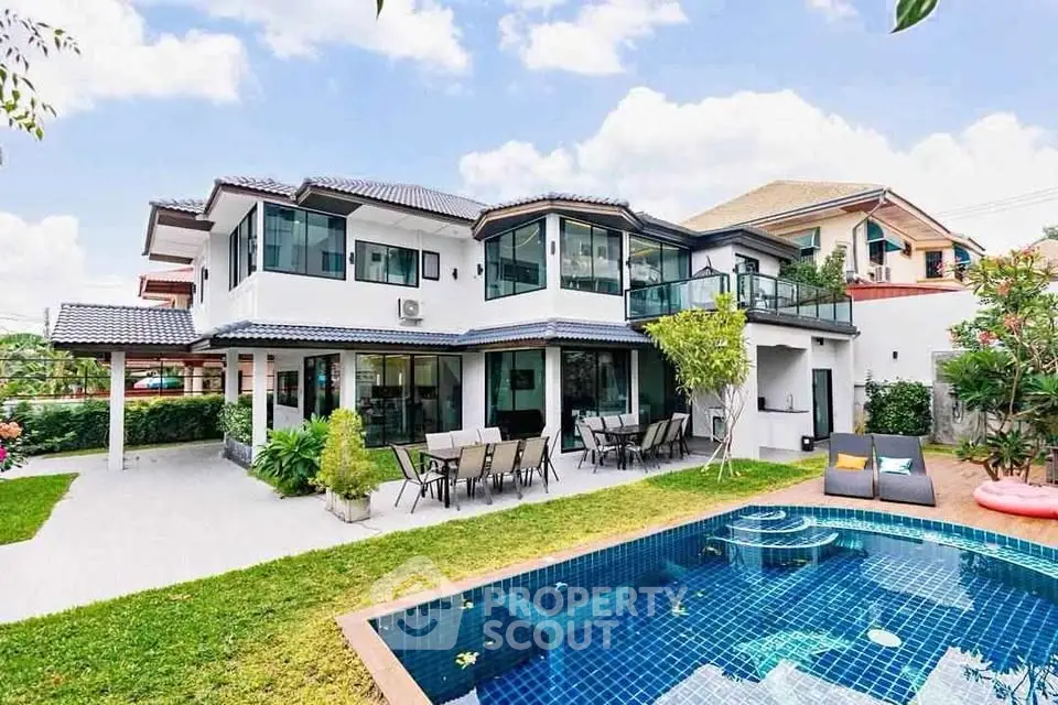Luxurious modern home with pool and spacious garden, perfect for family living.