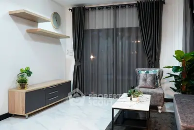 Modern living room with elegant decor, featuring a stylish armchair, sleek shelves, and lush indoor plants.