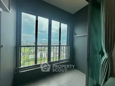 Modern balcony with panoramic city view and sleek glass doors