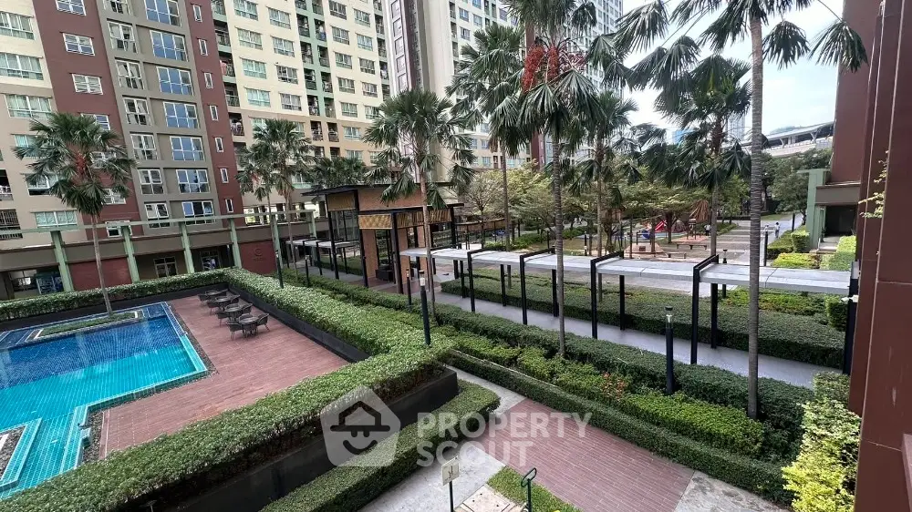 Luxurious condominium with pool and lush garden view in urban setting