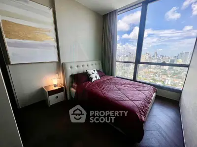 Luxurious bedroom with stunning city view and elegant decor