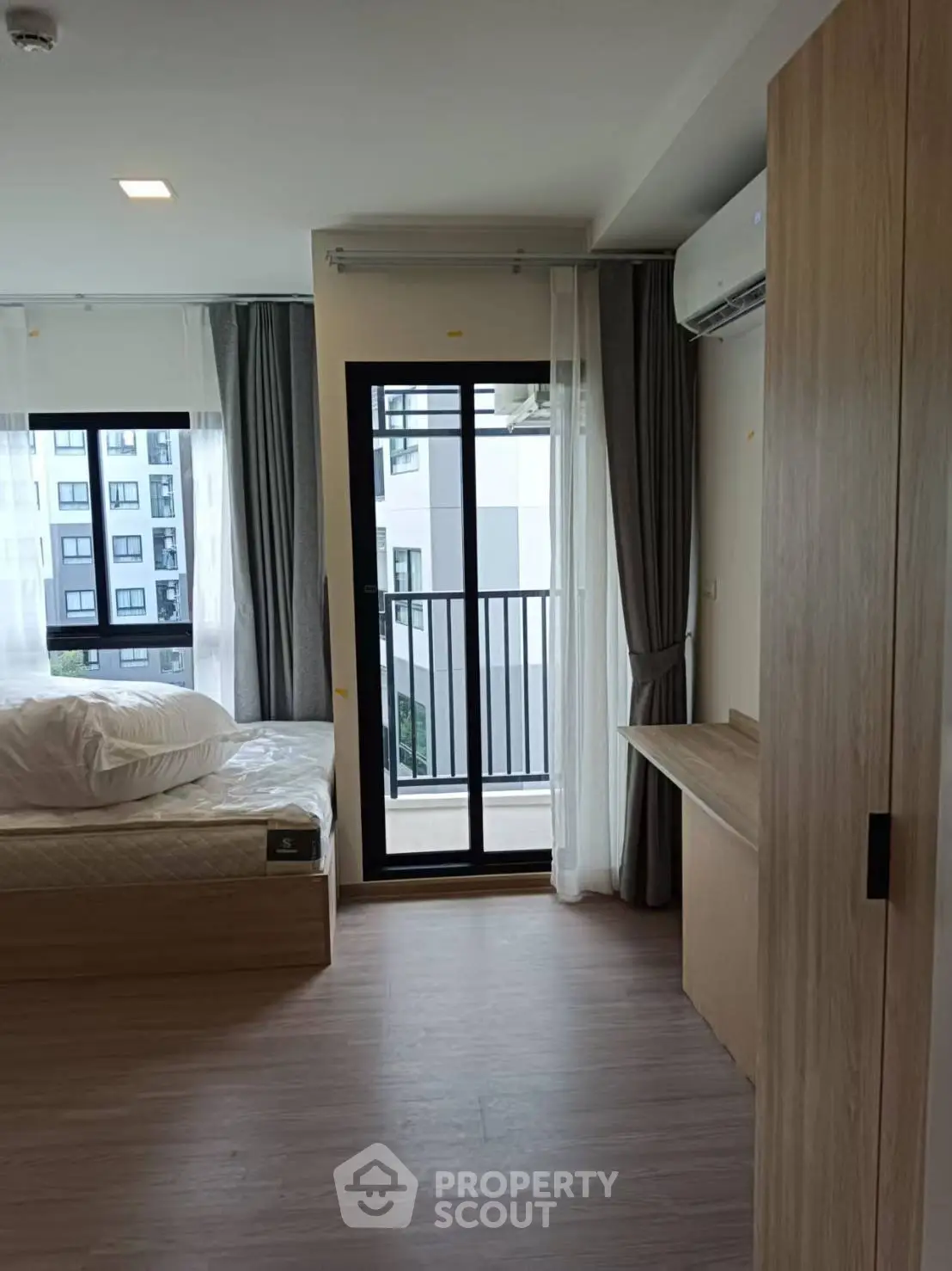 Modern bedroom with balcony view in a stylish apartment