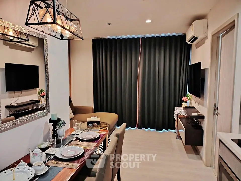 Stylish modern living room with elegant dining setup and cozy seating area.
