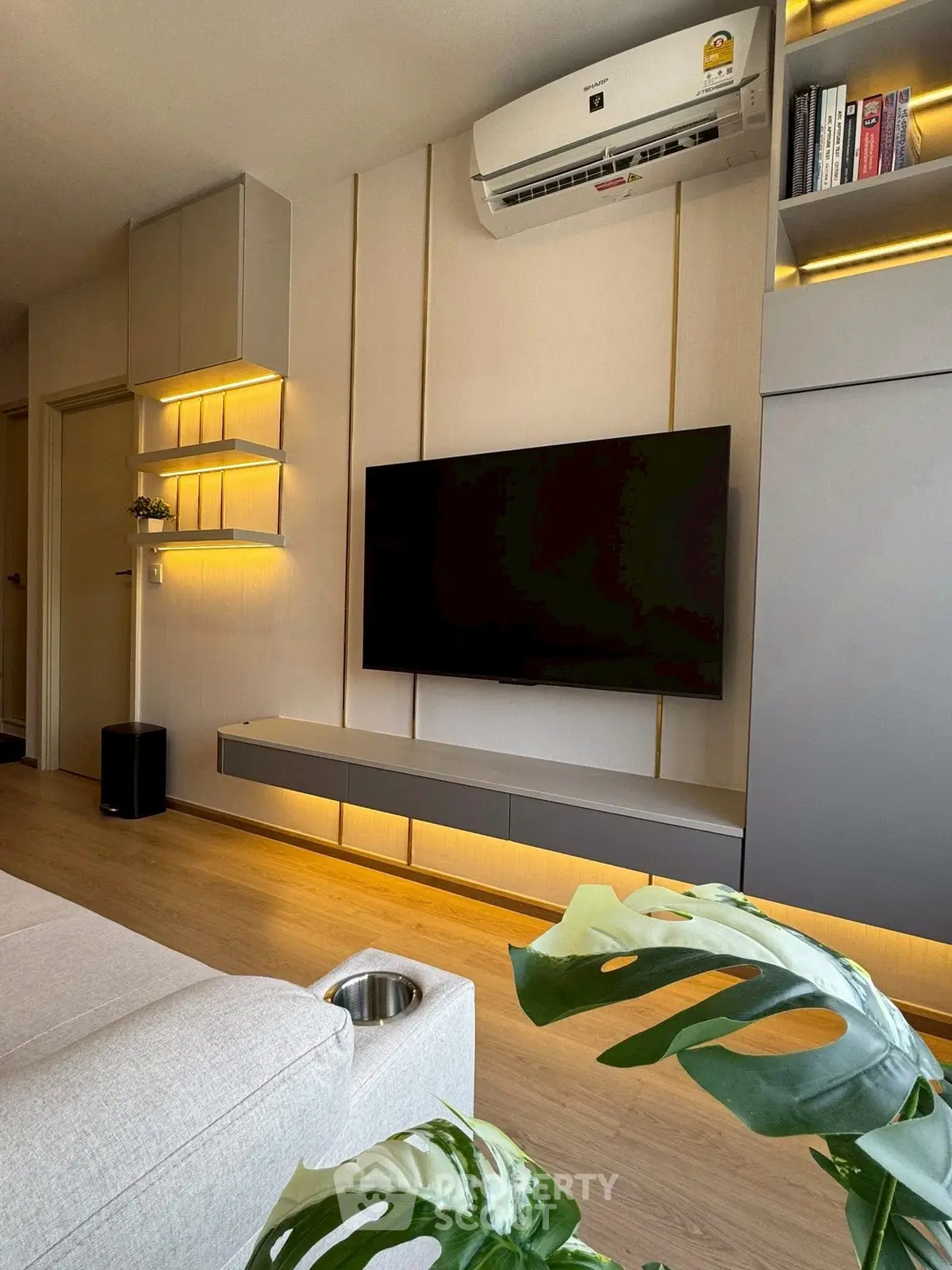 Modern living room with sleek TV setup and ambient lighting