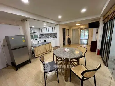 Spacious open-layout kitchen with dining area and modern appliances
