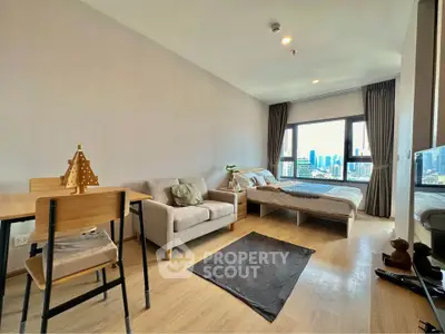 Modern studio apartment with city view, featuring cozy living area and stylish decor.