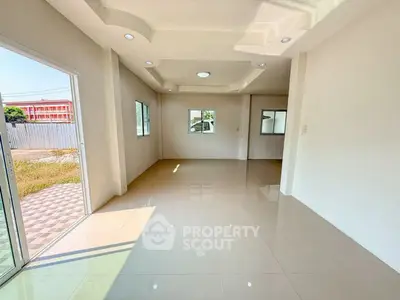 Spacious empty room with large windows and glossy tiled floor, perfect for customization.