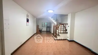 Spacious interior with staircase and tiled flooring, ideal for customization.