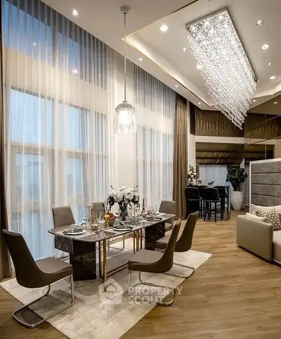 Luxurious modern dining room with elegant chandelier and floor-to-ceiling windows in a stylish apartment.