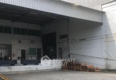 Spacious industrial warehouse with loading dock and ample storage space.