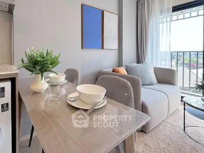 Modern living room with stylish decor and balcony view in a contemporary apartment.