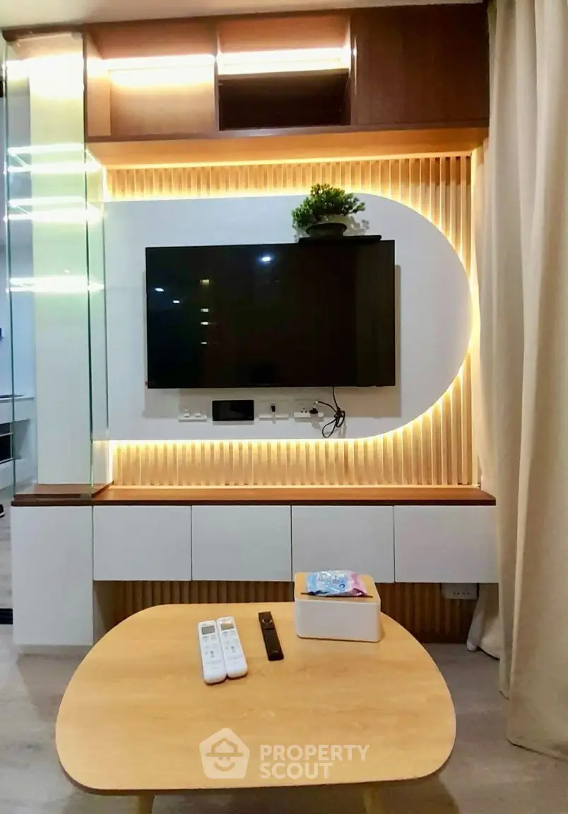 Modern living room with stylish TV setup and ambient lighting