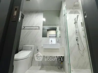 Modern bathroom with sleek fixtures and marble walls