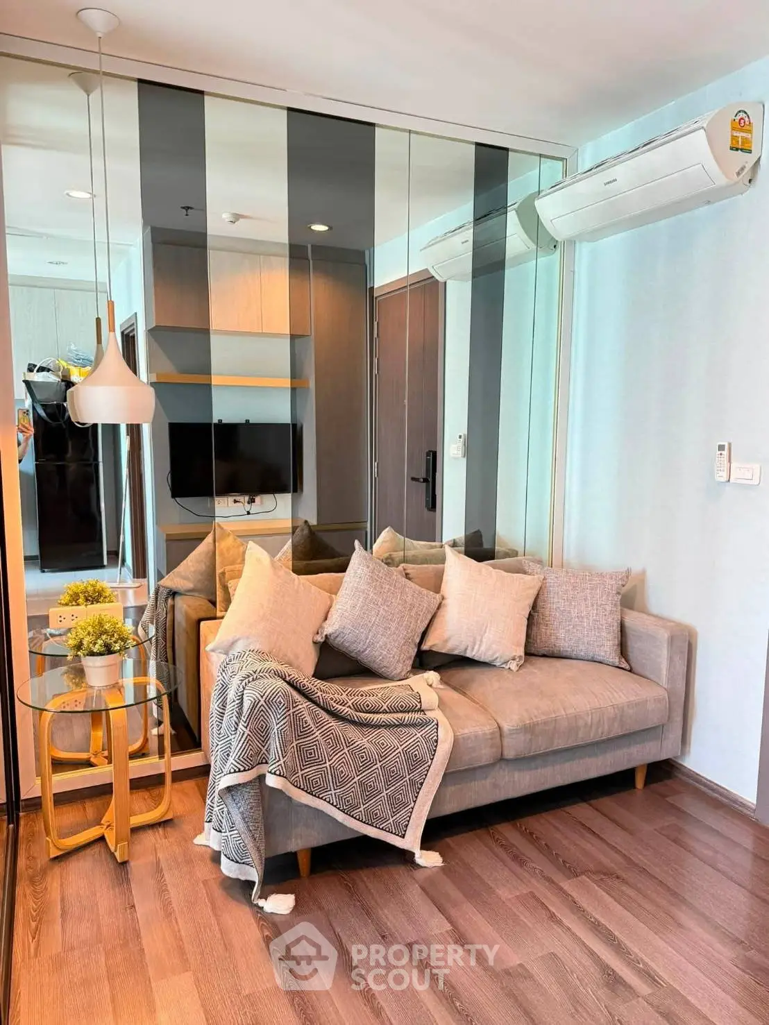 Modern living room with stylish decor and cozy sofa in a contemporary apartment.