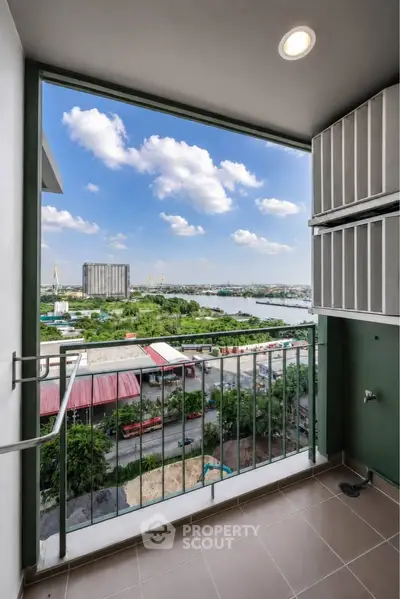 Stunning balcony view overlooking river and cityscape, perfect for relaxation and enjoying the skyline.