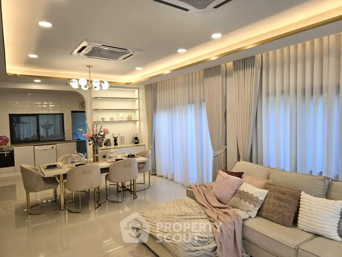 Luxurious open-plan living room with elegant dining area and modern decor