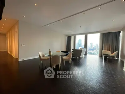 Spacious modern living room with city view and elegant dining area