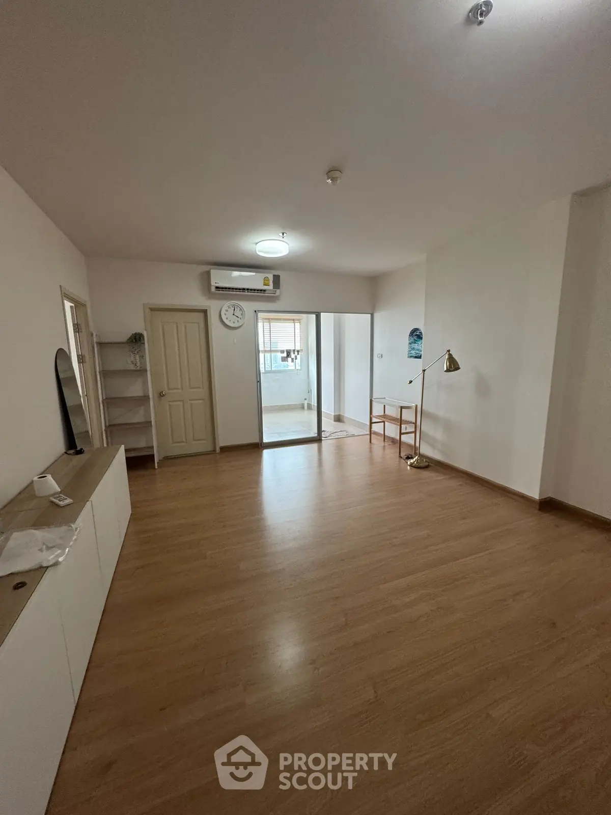 Spacious living room with wooden flooring and modern decor