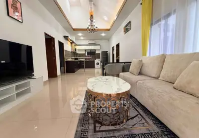Spacious modern living room with elegant decor and open kitchen layout