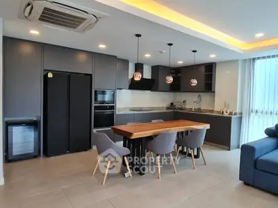 Modern kitchen with sleek cabinetry and stylish dining area