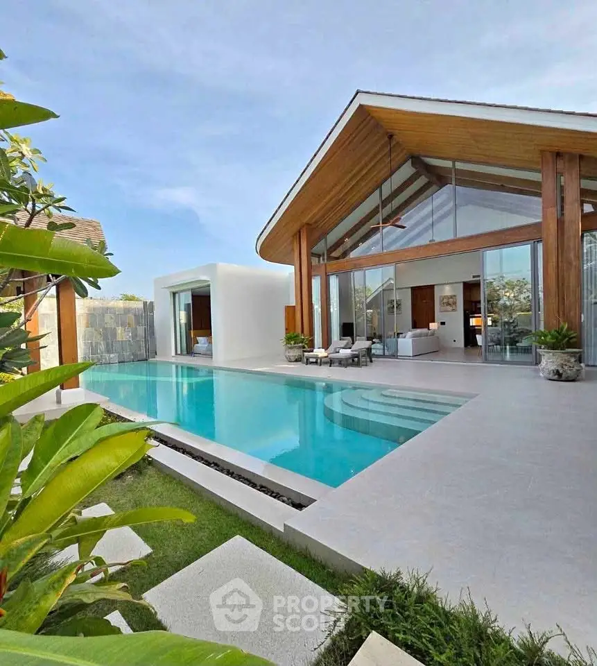 Luxurious modern villa with stunning pool and elegant architecture, perfect for upscale living.