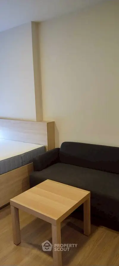 Cozy bedroom with modern furniture and wooden flooring