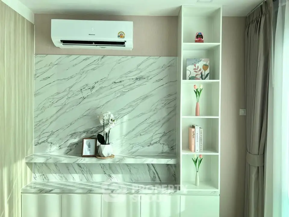 Stylish modern living room with marble accents and built-in shelving