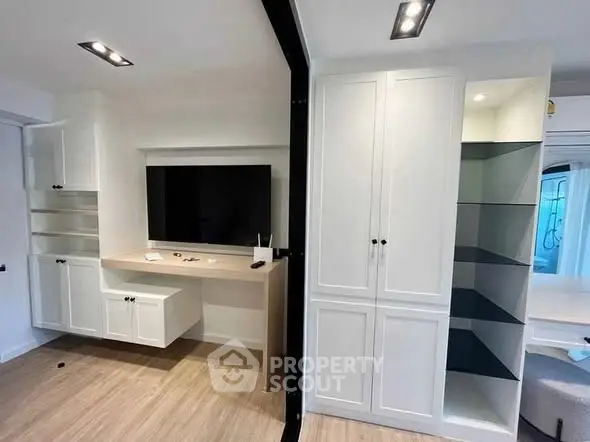 Modern living room with built-in storage and sleek TV setup