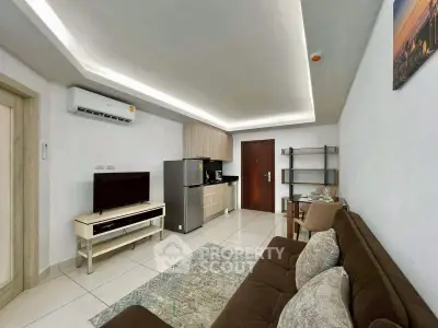 Modern living room with sleek kitchen, stylish furniture, and contemporary decor in a cozy apartment.