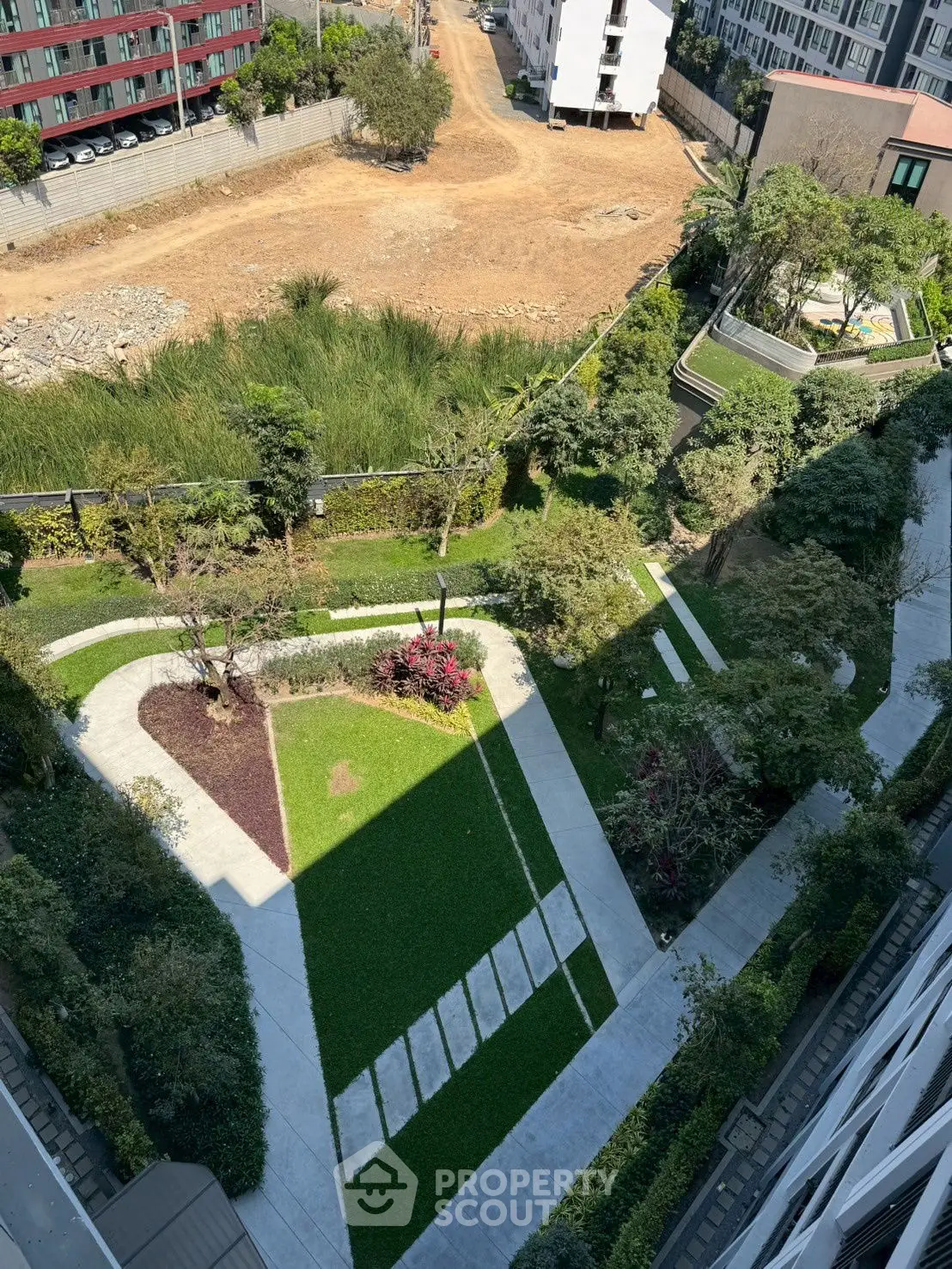 Stunning aerial view of modern landscaped garden in urban residential complex.