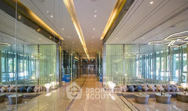 Luxurious modern building lobby with elegant seating and mirrored walls