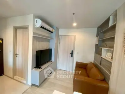 Modern living room with sleek design, featuring a leather sofa, wall-mounted TV, and stylish shelving.