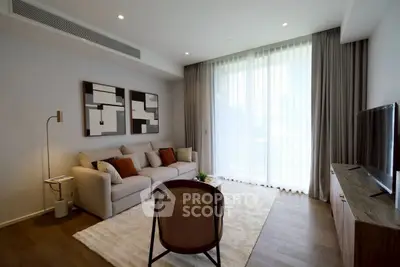 Modern living room with stylish decor and large window for natural light