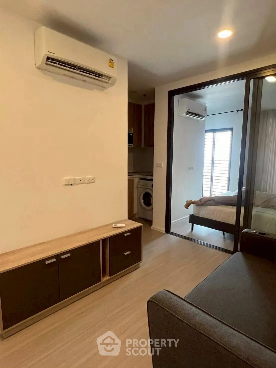 Modern apartment interior with air conditioning and washing machine