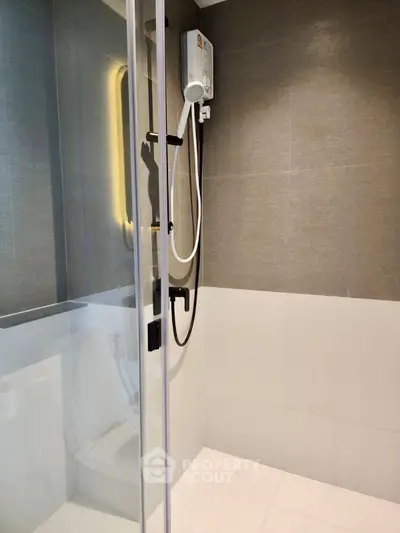 Modern bathroom with glass shower enclosure and sleek design