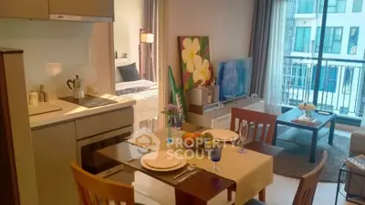 Modern open-plan living and dining area with balcony view in stylish apartment