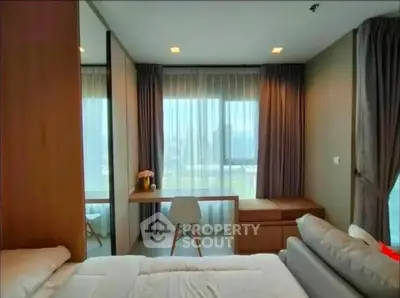 Modern bedroom with large window and stylish decor