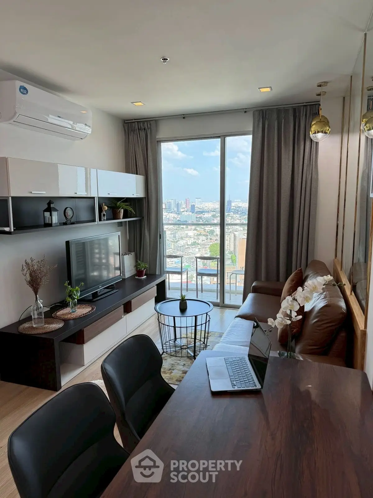 Modern living room with city view, stylish furniture, and natural light, perfect for urban living.