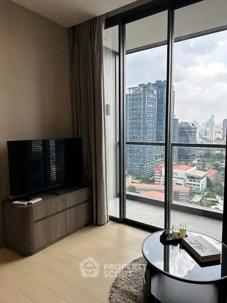 Modern living room with city view and balcony access in high-rise apartment.