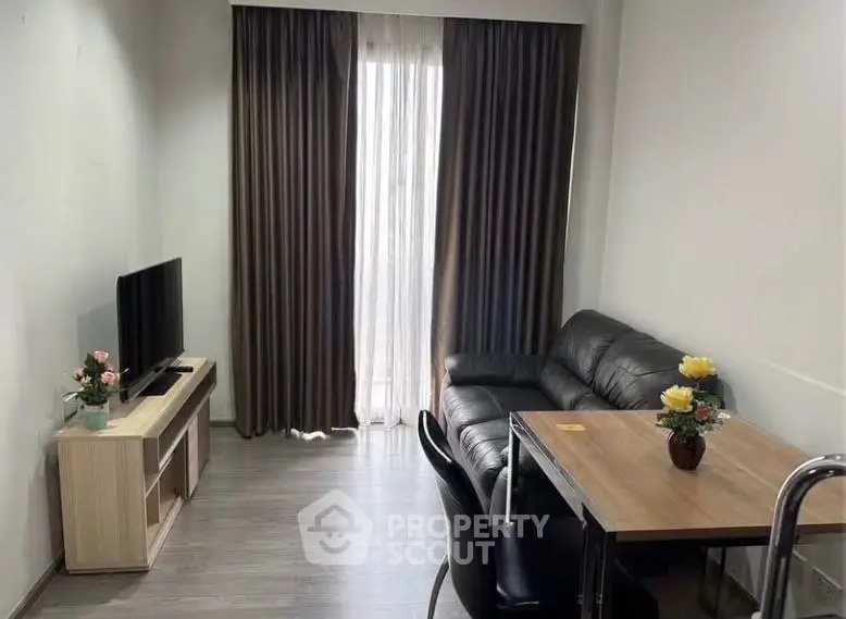 Modern living room with sleek furniture and natural light, perfect for cozy gatherings.