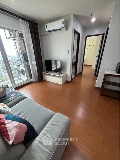 Modern living room with balcony view and stylish decor