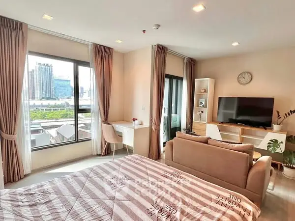 Modern studio apartment with city view and cozy living area