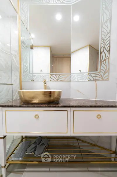 Luxurious bathroom with elegant gold accents and modern sink design