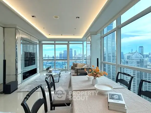 Luxurious high-rise living room with panoramic city views and elegant dining area.