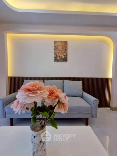 Modern living room with elegant lighting and stylish decor